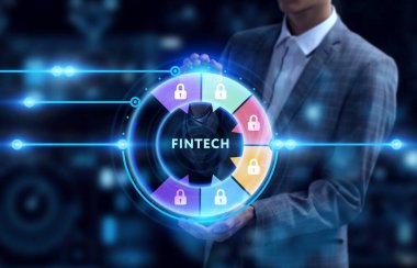 İş, Teknoloji, İnternet ve ağ konsepti. Genç işadamı geleceğin sanal ekranı üzerinde çalışıyor ve Fintech yazısını görüyor.