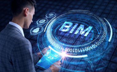 İş, teknoloji, internet ve şebeke kavramı. Geleceğin sanal ekranı üzerinde çalışan genç bir girişimci yazıyı görür: BIM