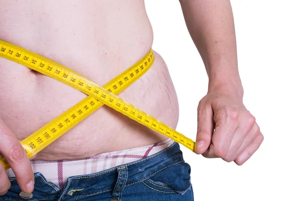 Mujer gorda midiendo su cintura — Foto de Stock