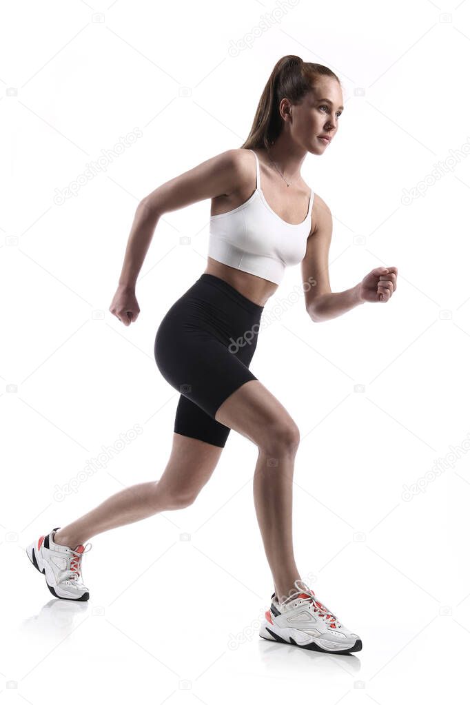 Running fitness woman. Active healthy lifestyle. Isolated on white. Studio shot.