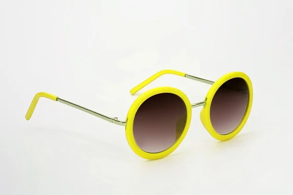 Fashionable yellow plastic sunglasses — Stock Photo, Image