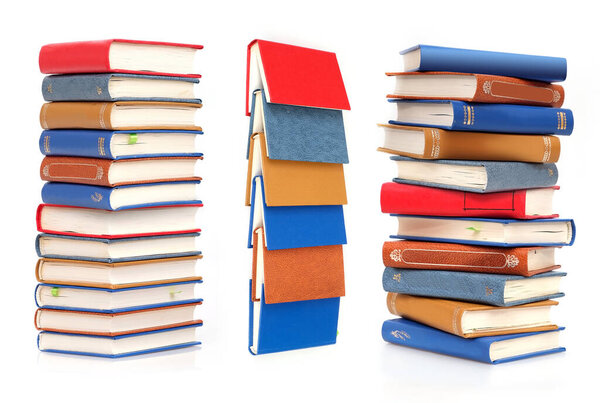 Stack of books in colour covers with white sheets isolated on a white background