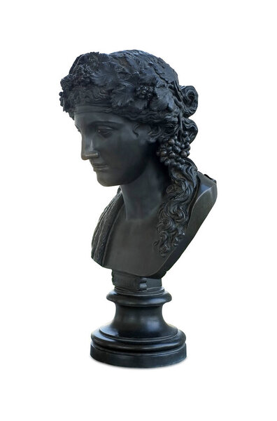Bronze antique bust of the ancient Roman god Bacchus, isolated on white background. The inscription on the pedestal "Bacchus". Design element with clipping path