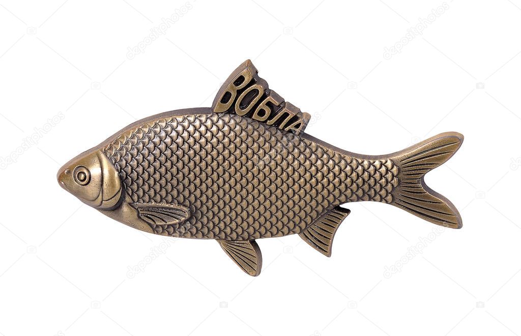 Metal golden  fish isolated on white background. Russian inscription means 