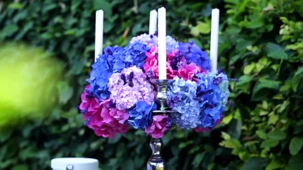 Candlestick with blue flowers — Stock Video