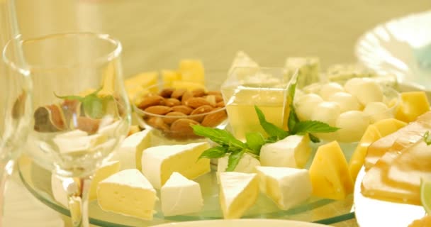 Different kinds of cheese on glass background — Stock Video