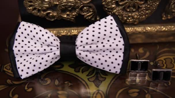 Silver cuff links and red bow tie — Stock Video