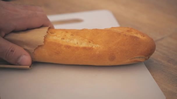 4k video of french baguette on the table and a bowl. — Stock Video