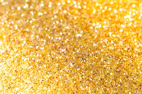 Gold defocused Christmas festival glitter background with copy s