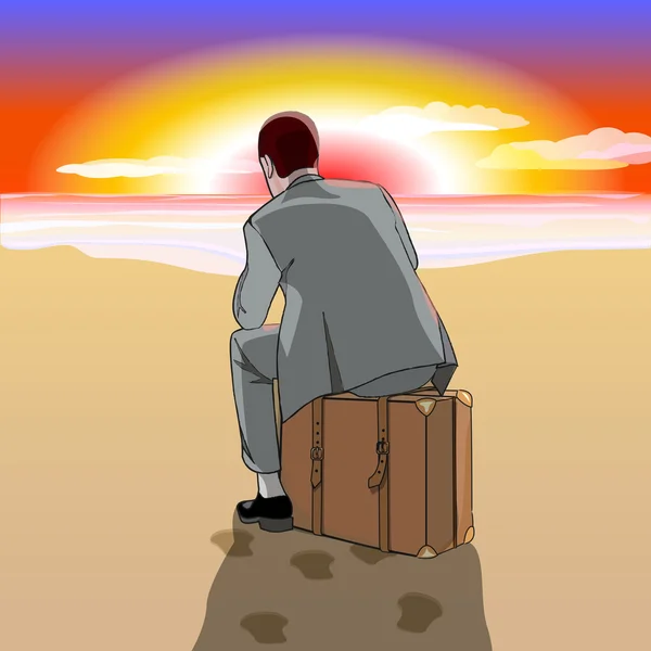 Plajda bavul üzerinde oturan adam