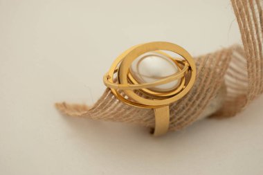 golden rings with a rope on white background