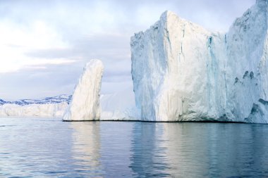 Huge and beautiful glaciers are on the arctic ocean to Ilulissat fjord, Greenland clipart