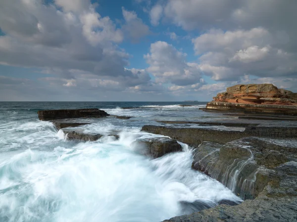 Long exposure shot on amazing rocks with sea wave — Stock Photo, Image