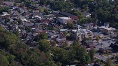 Discover the beauty of Berkeley Springs, West Virginia from above, showcasing its historic charm, lush greenery, and vibrant community throughout summer.