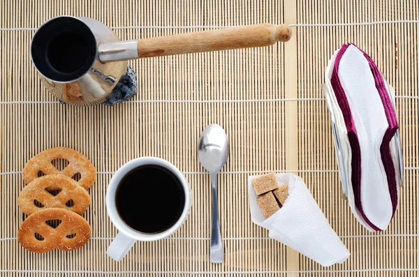 Cup of coffee on a bamboo napkin,  top view