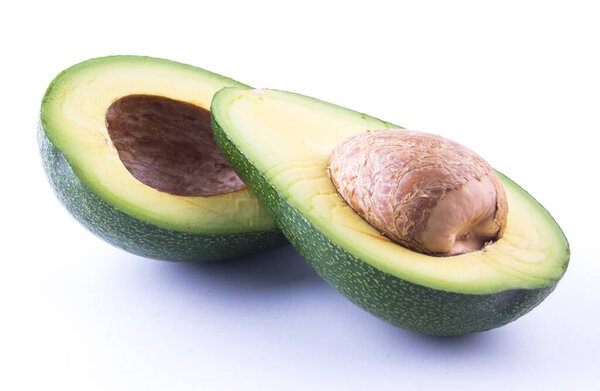 Two slices of avocado isolated on the white background