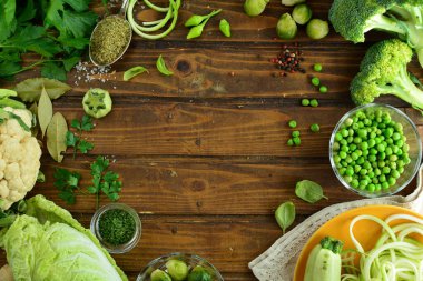 healthy food concept with fresh vegetables on wooden table