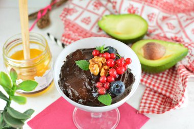 Chocolate Avocado Mousse on background, close up