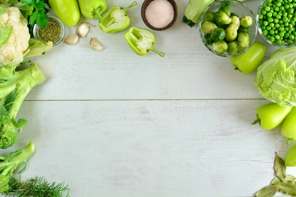 fresh vegetables on a wooden table background