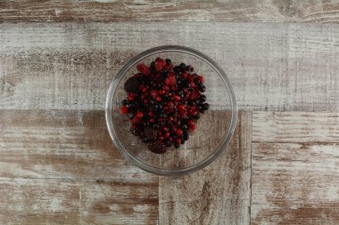 fresh berries on a wooden background, close up