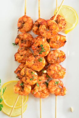 Spicy Grilled Shrimp Skewers on background, close up