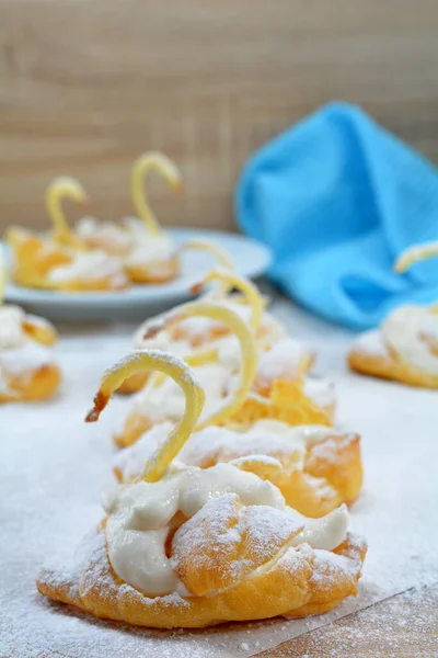 homemade Cream Puff Swans on background, close up