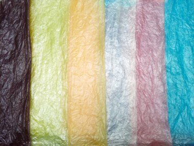 Multi color crumpled plastic bag texture background. Real Low-Density Polyethylene shopping bag. LDPE shopper texture