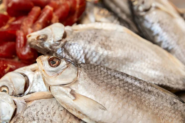 Many dried fish and fish roe. Close-up, selective focus