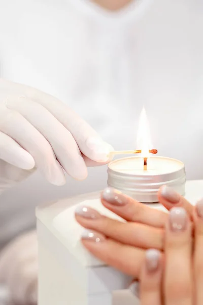 Manicure Master White Gloves Lighting Candle Match Nail Salon — Stock Photo, Image