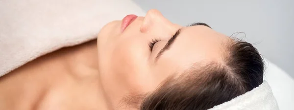 Side View Young Woman Lying Beautician Table Closed Eyes While Stock Picture