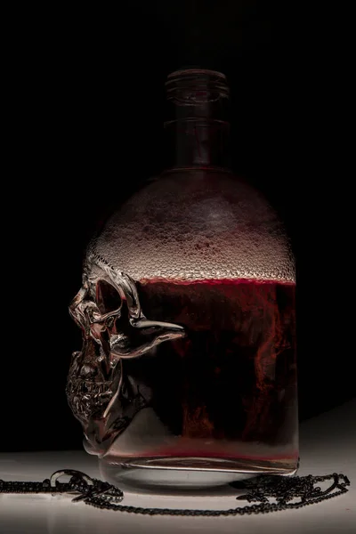 Skull Bottle Composition Red Water Swirl — Stock Photo, Image