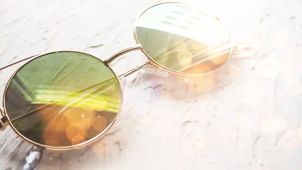 banner mirrored glasses with reflection on a white background, space for text.