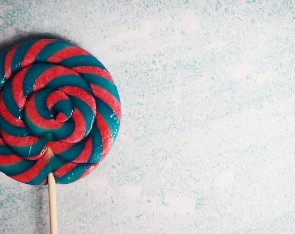 Swirly colorful lollipop candy with a nice color combination. — Stock Photo, Image