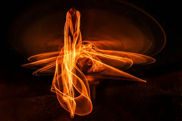Fogo neon freezelight abstrato à noite — Fotografia de Stock