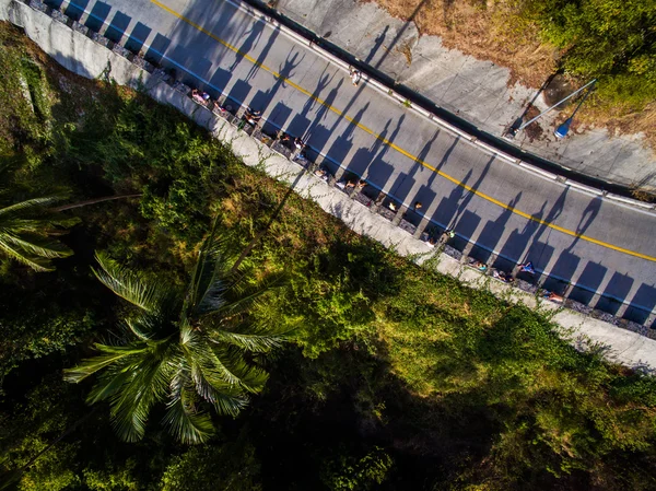 The shadow people in the jungle, on the road from the height of aerial view — Stock Photo, Image