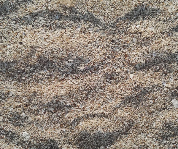 Смешанная текстура песка крупным планом с дневным освещением — стоковое фото