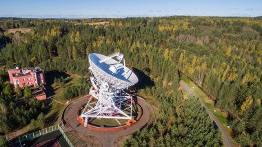 Aerial view radio telescope in forest at countryside in saint-Petersburg Russia clipart