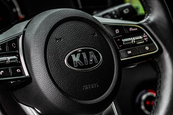 MOSCOW, RUSSIA - JANUARY 10, 2021 KIA XCeed. AWD Hatchback SUV. New KIA XCeed crossover model year 2020. KIA company badge close up view on the steering wheel close up view.
