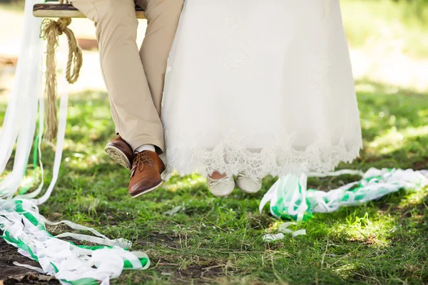 Legs of bride and groom — Stock Photo, Image