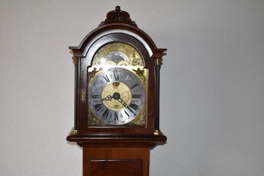 old vintage clock on a wooden table