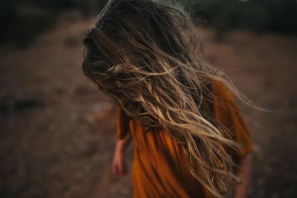 Girl with wind tousled hair — Stock Photo, Image