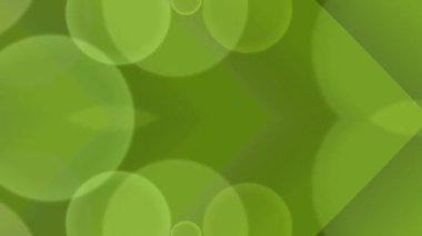 Bulanık saydam küresel şekillere sahip yumuşak yeşil soyut arkaplan modern tasarım için canlı ve dinamik bir görsel etki yaratıyor.