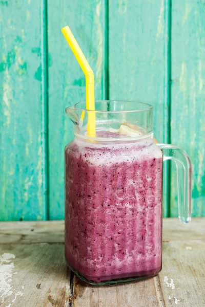 Blueberry smoothie on wooden table — Stock Photo, Image