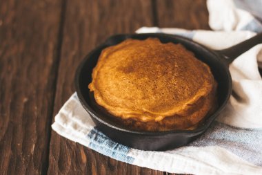 Delicious  pancakes  on pan on the table 