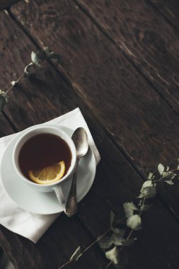 tea with lemon on wooden background 