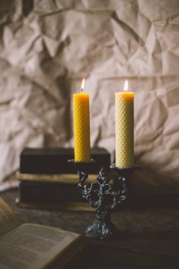 two candles in candelabrum on table 