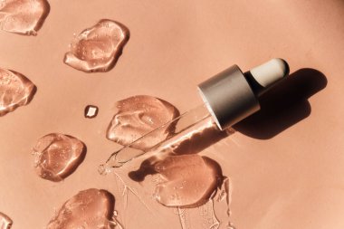 Kahverengi arkaplanda kozmetik jel dokusu