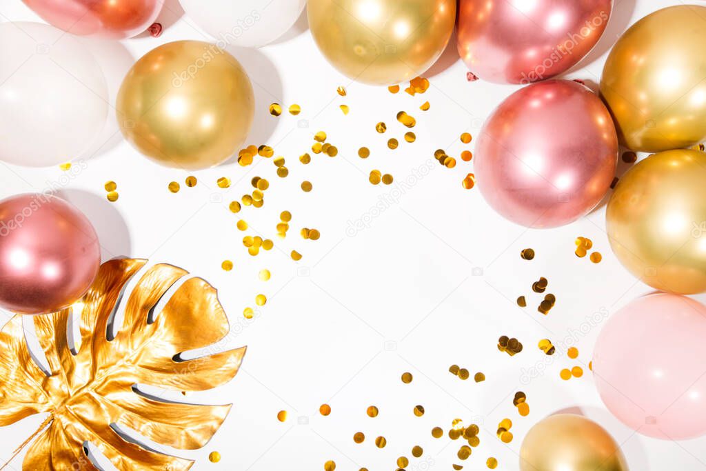 golden and silver balloons on white background