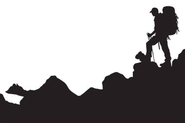 Bir yürüyüşçünün silueti dağın zirvesine ulaşıyor.