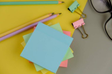 blank paper next to school tools with no word as a template for text space concept. business and education concept